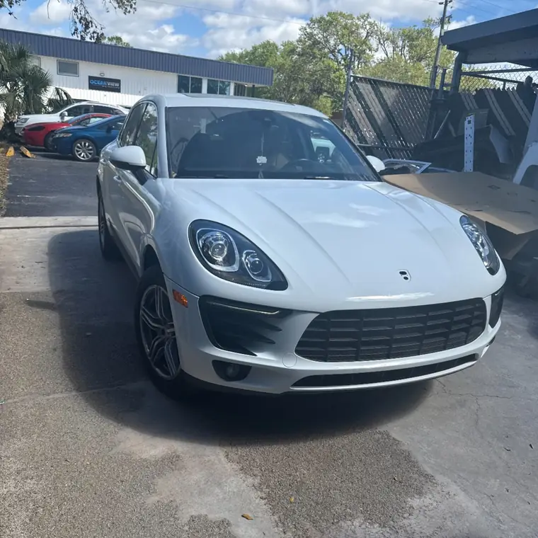 A white Porsche finished and ready for collection